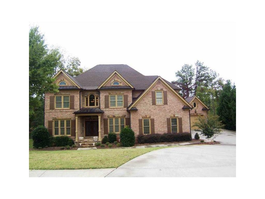 Exterior Front. 4 sides brick with 3 car side entr
