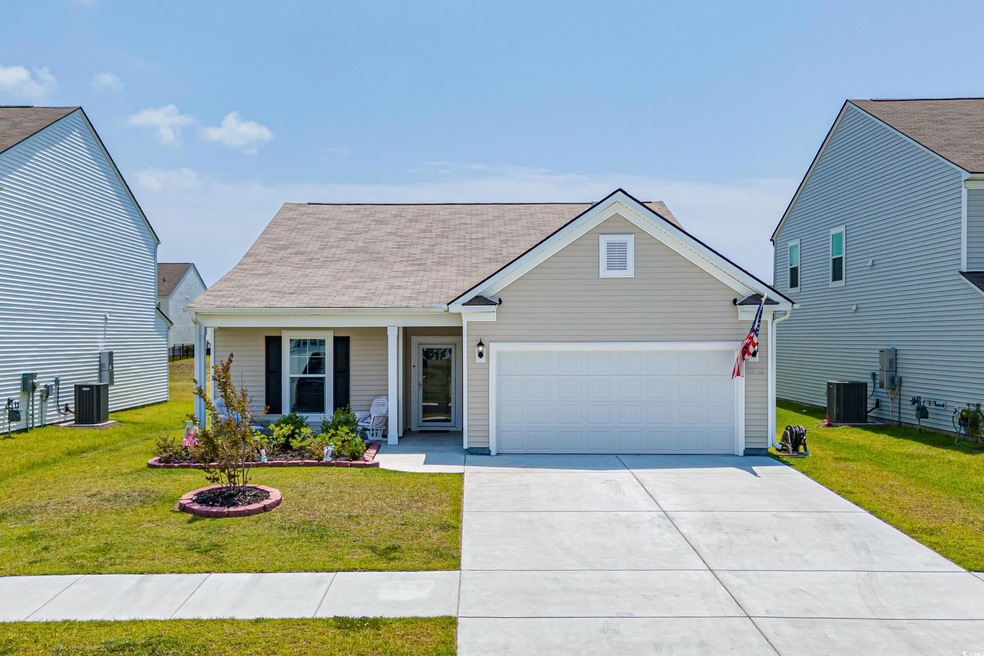 View of front of property featuring a garage, a fr