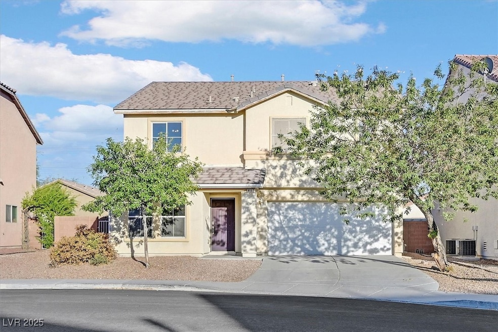 Traditional-style home featuring concrete driveway