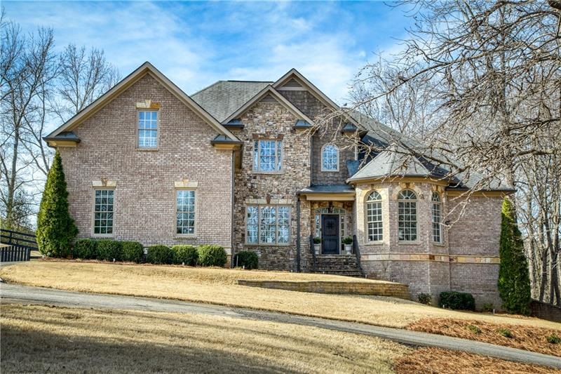 Four sided brick, with gorgeous stone accents.