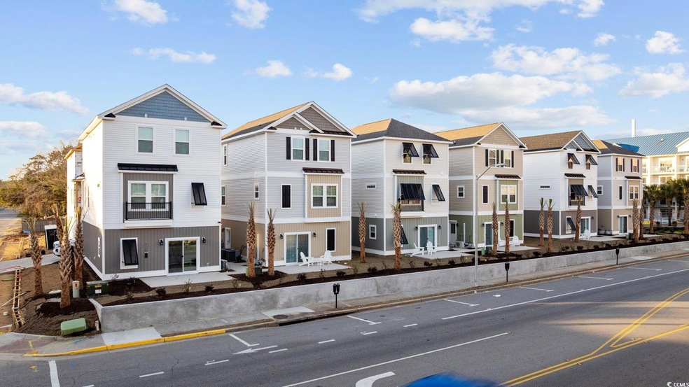 View of property with a residential view