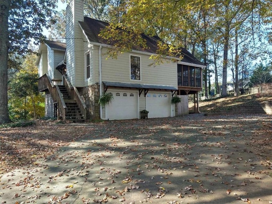Rear view of house with a garage