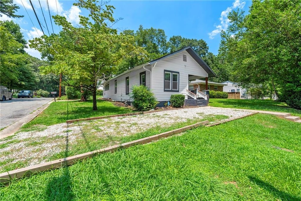 View of property exterior featuring a yard