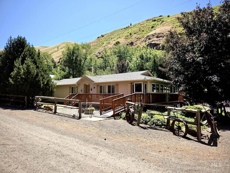 Single story home with a deck with mountain view