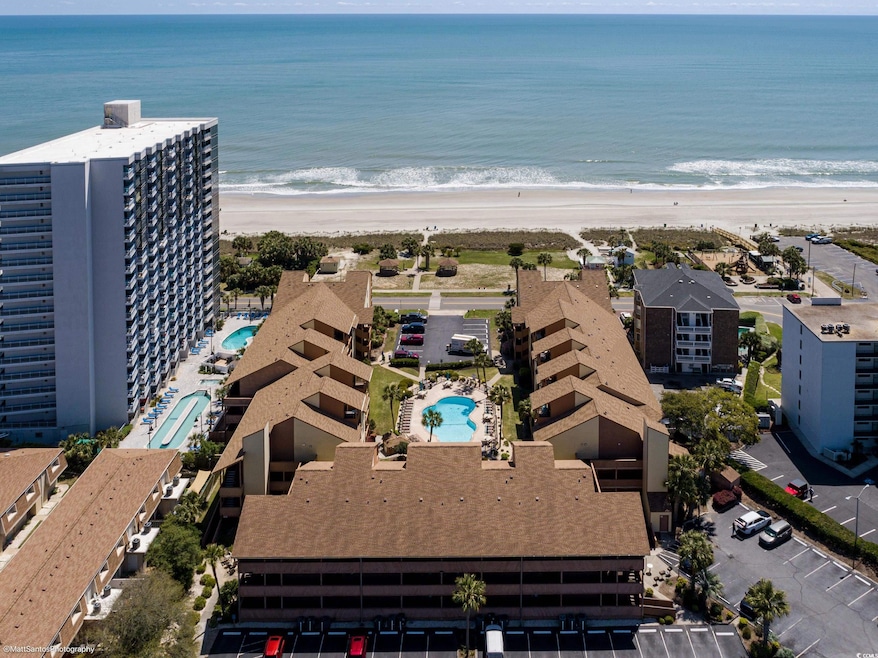 Aerial view with a beach view and a water view