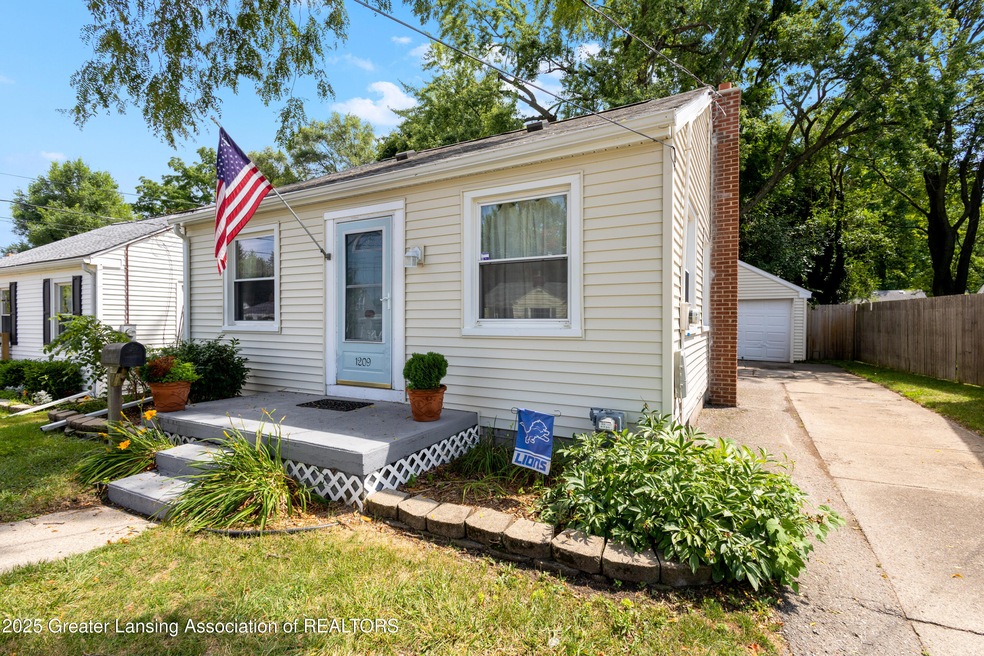 1209 W Rundle Ave, Lansing, MI 48910 - photo 1