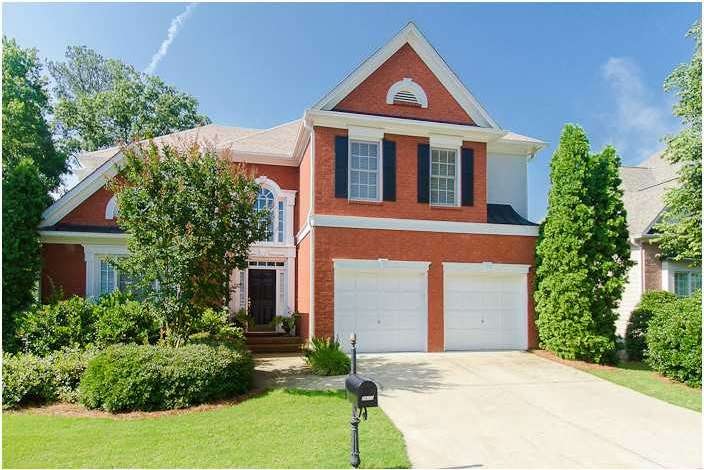 Exterior Front. Front of home with brick and 2 car