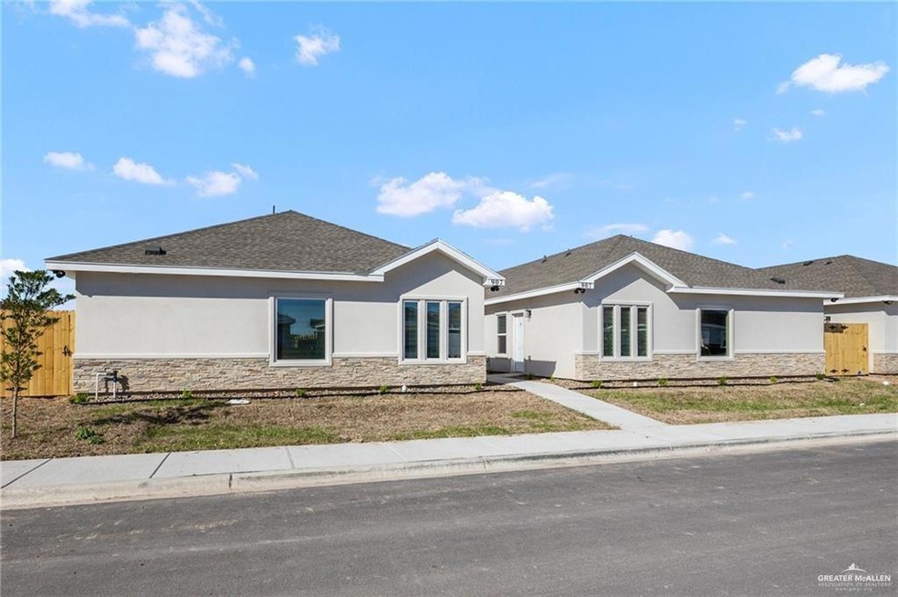 Ranch-style home featuring stone siding, roof with shingles, fence, and stucco siding