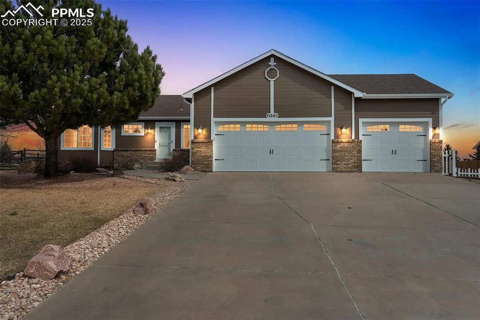 View of front of house featuring a shingled roof, 