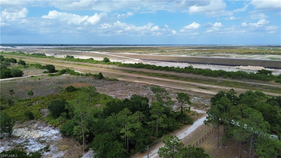 Birds eye view of property with a rural view