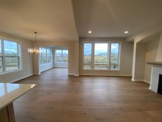 Charming Villa with HOA lawn care and snow removal. Large azek covered front porch. Beautiful exterior! Landscaping sod & irrigation now completed. Plus Azek deck & stairs and abundance of windows with pond views.