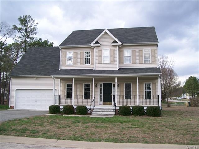 Front of house with large covered front porch. Cor