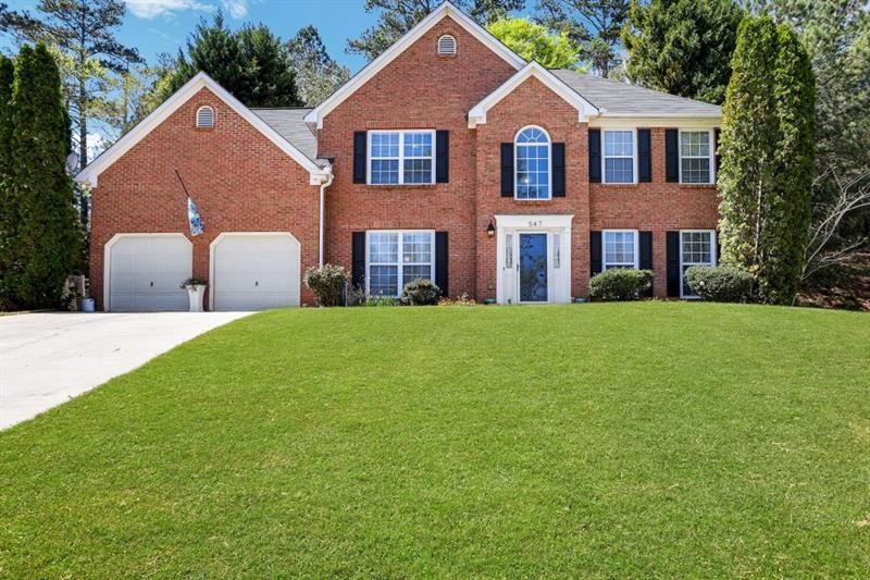 Welcome home to this gorgeous brick traditional in