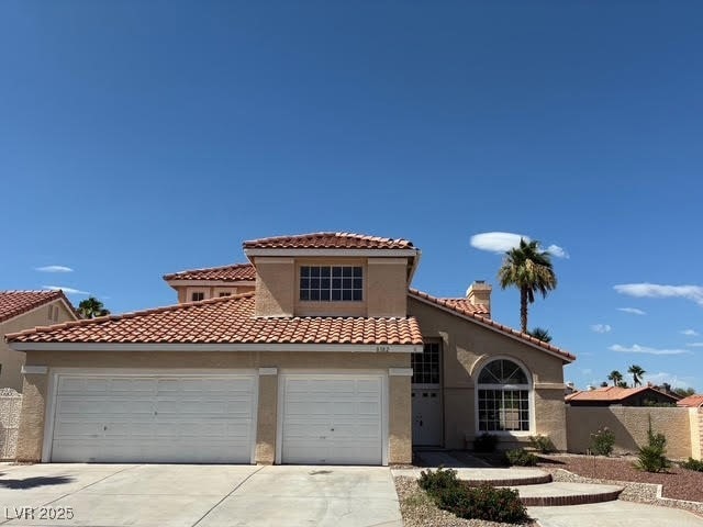 Mediterranean / spanish-style house featuring driv