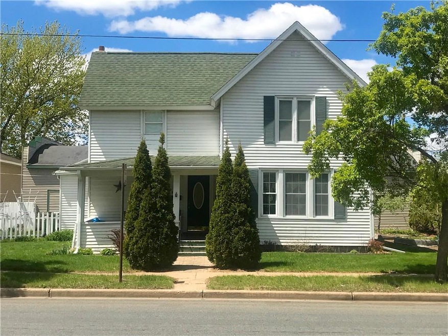Front view of home with porch.