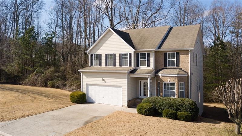 Situated beautifully on the lot with green space n