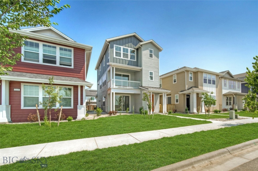 Three story farmhouse with views of farmland and t