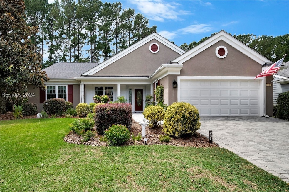 View of front of property with a front lawn and a
