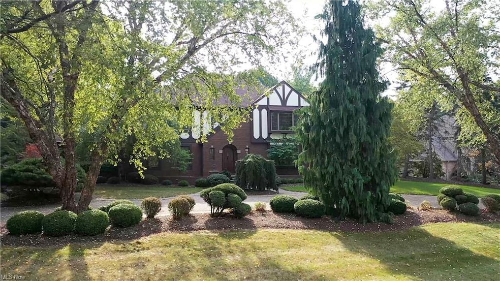 Fabulous English Tudor meticulously maintained on a private lot located in prestigious Winterberry Green.