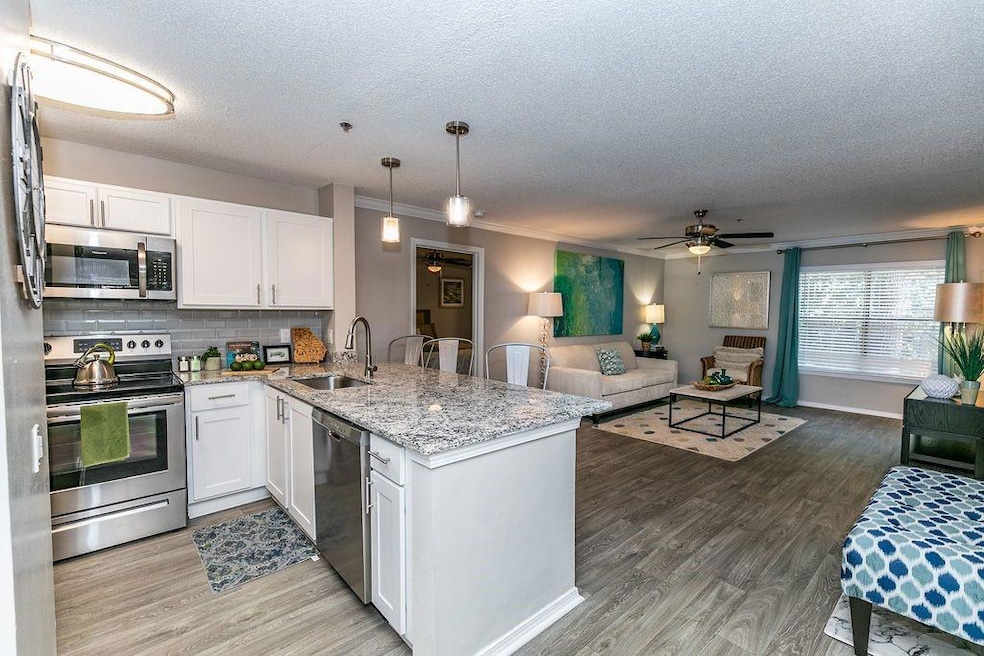 Kitchen featuring light wood-type flooring, orname