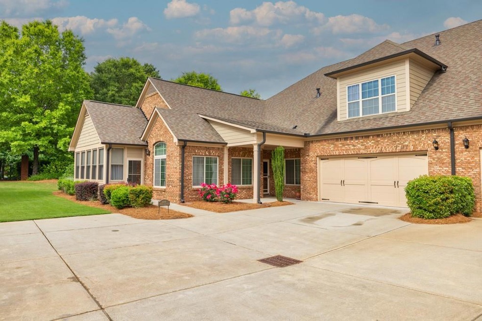 View of front facade featuring a garage