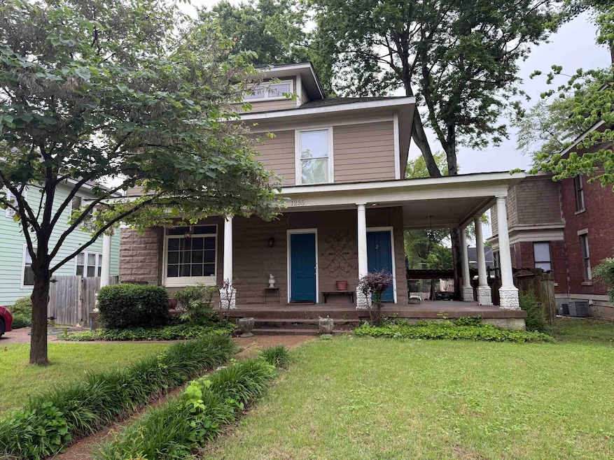 View of front facade featuring covered porch and c
