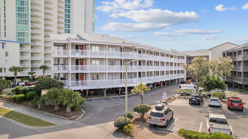 View of apartment building / complex with uncovere