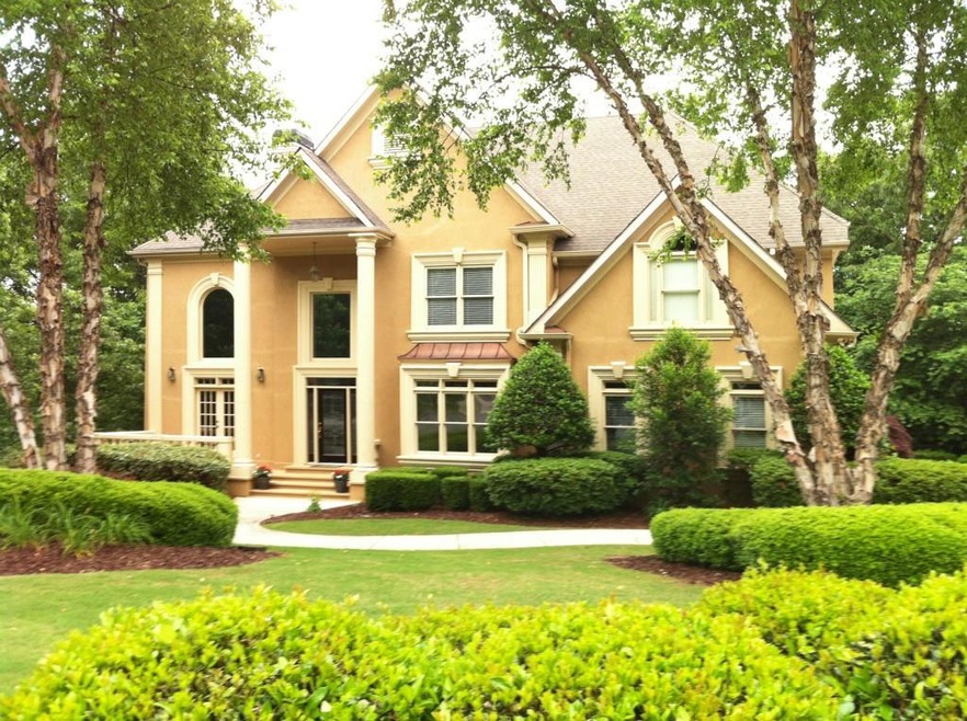 Stately, well-maintained hardcoat stucco home on d