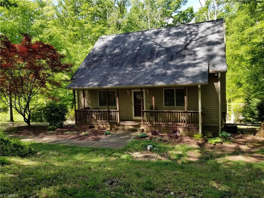 WELCOME HOME TO THIS PARCEL OF PARADISE!  Long front porch sets off the outdoor living area of this home that is beautifully situated on 1.51 AC lot and backs up to Mears Fork Creek.