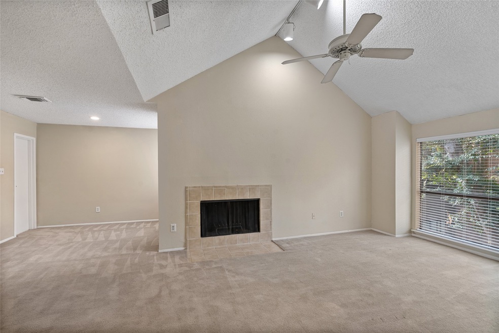 Soaring cathedral ceiling in the spacious living r