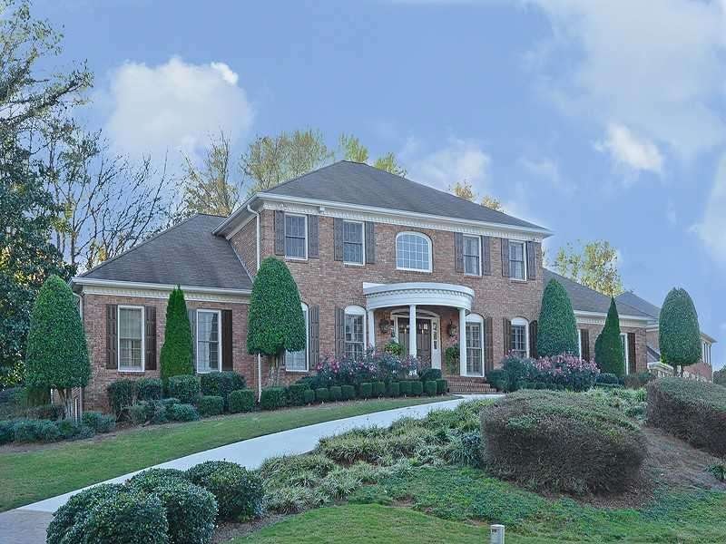 Exterior Front. Stately 4-sides brick home on prof