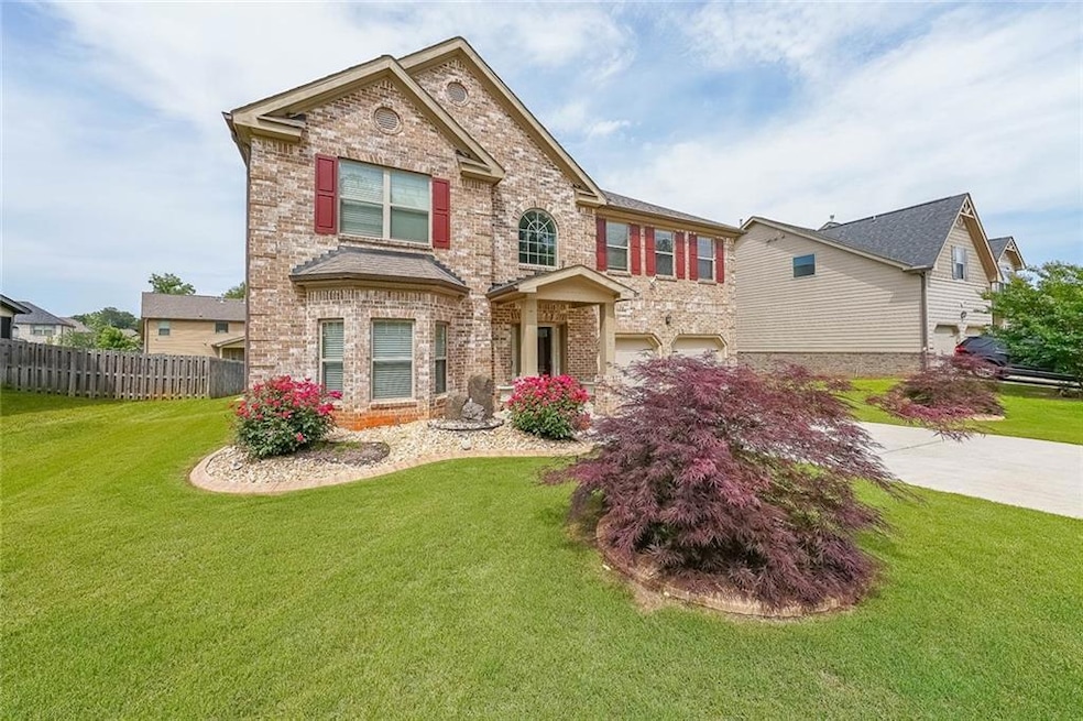 View of front of home featuring brick siding, an a