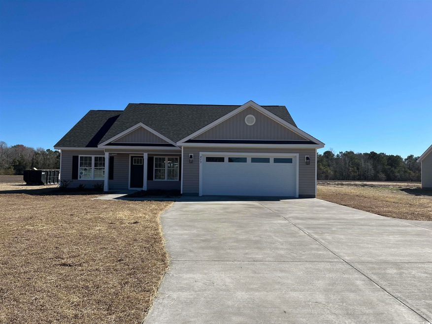 View of front of property with an attached garage,