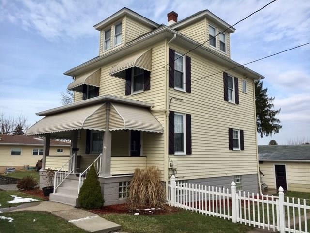 Charming Curb Appeal with Covered Front Porch.