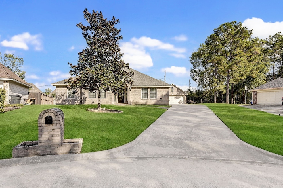 Home has long drive way leading to detached 2 car