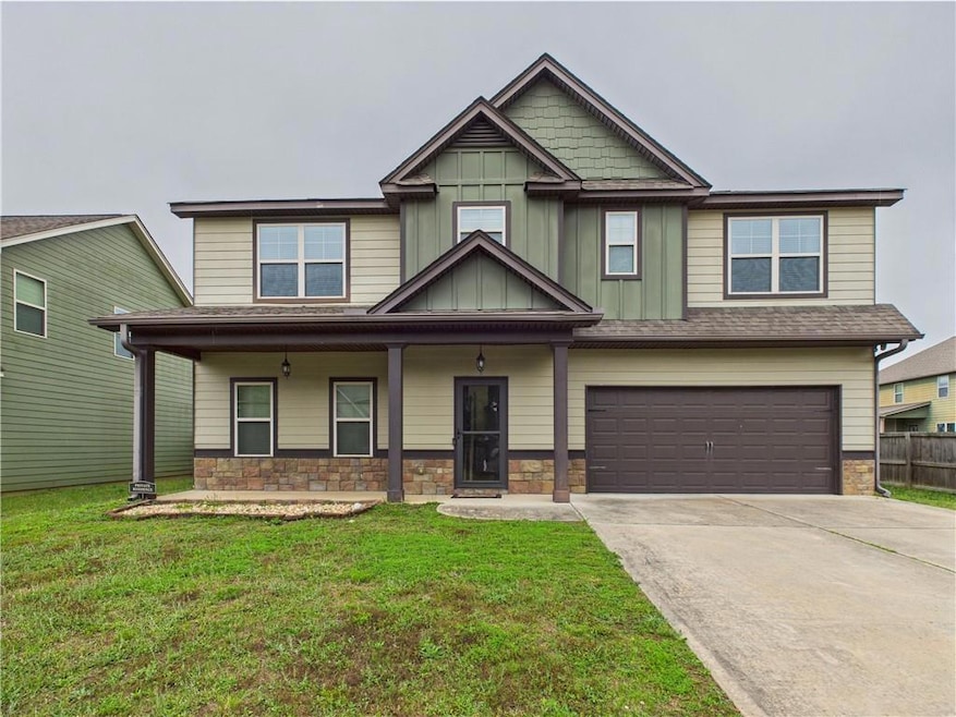 Craftsman-style house featuring an attached garage