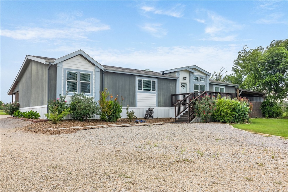 Manufactured / mobile home featuring a deck and st