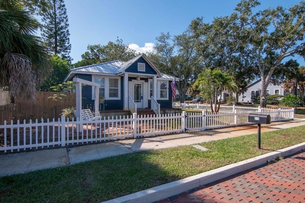 Front yard, with a cozy swing for two.