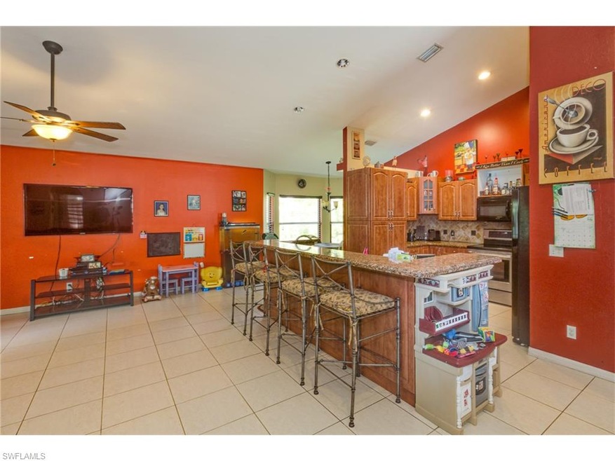 Family room with view of kitchen on right