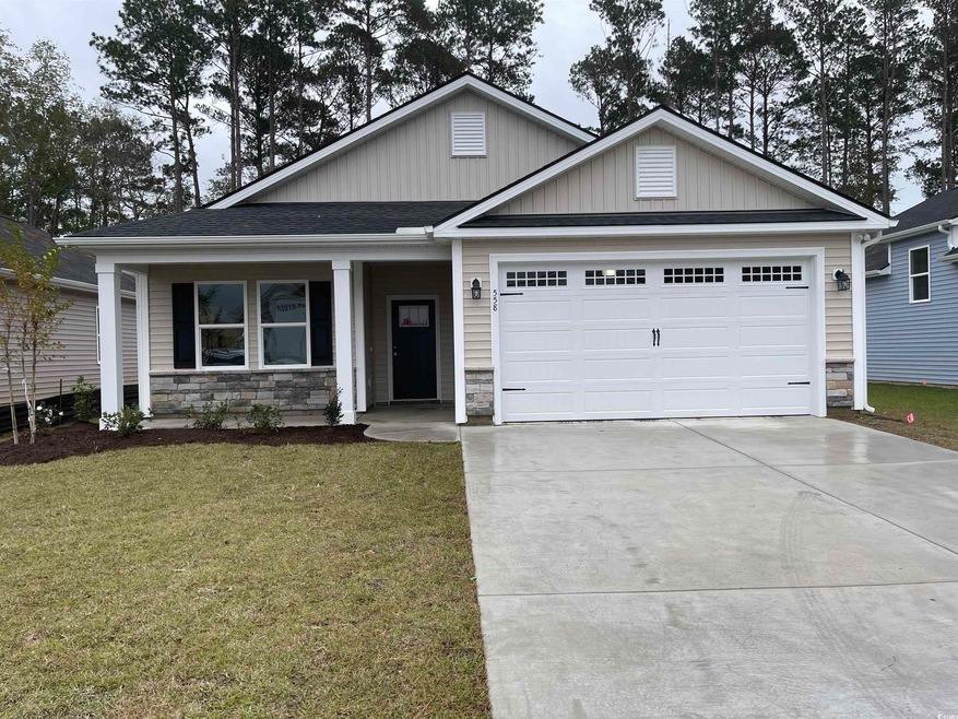 View of front of house featuring a garage and a fr