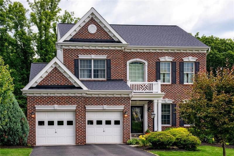 A level front driveway leads to this beautiful hom