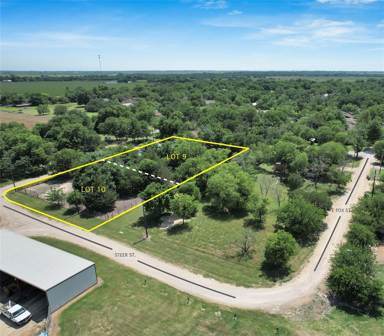 Aerial view of property and surrounding area with