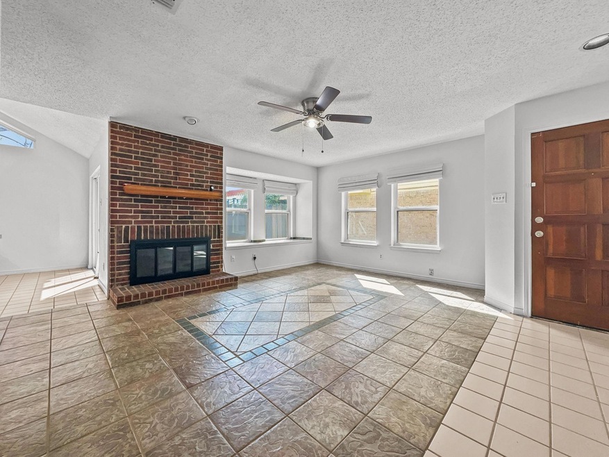 Living room with natural light and fireplace