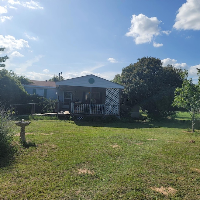 Back of property with a deck