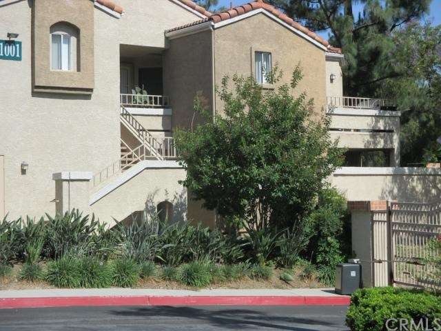 Front entrance to condo on the right with street v