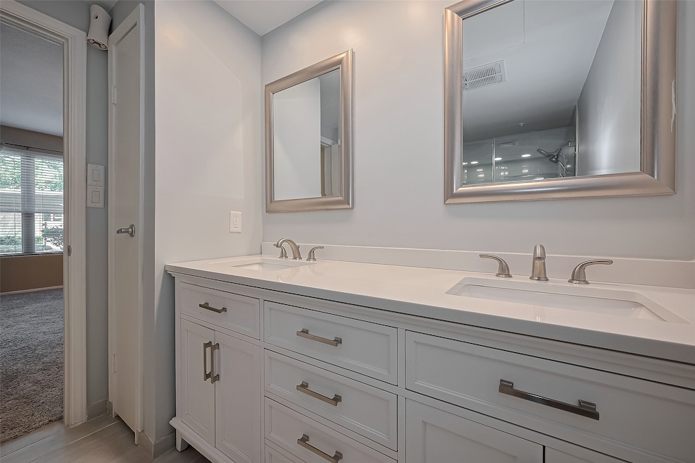  Beautifully updated primary bathroom, featuring e