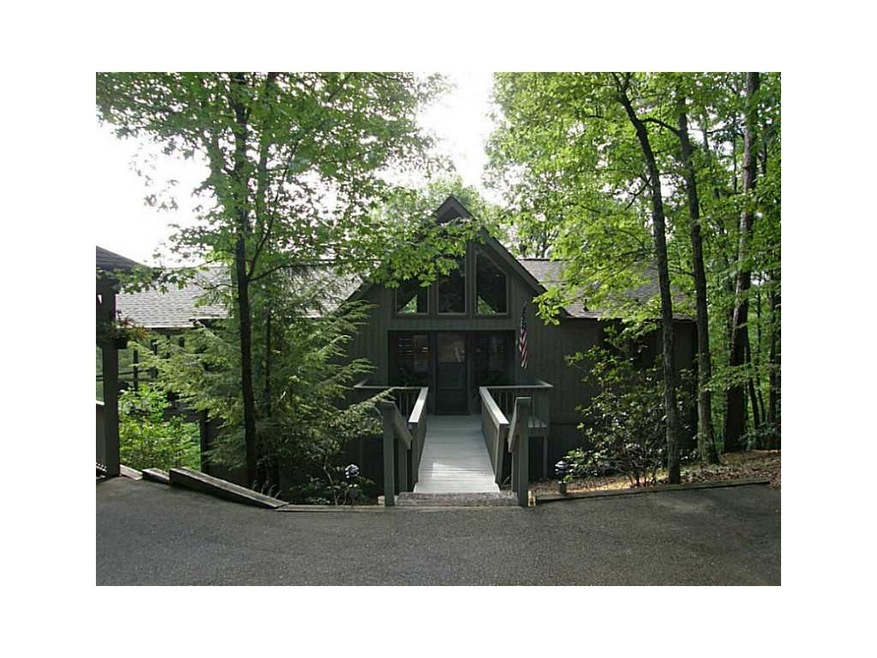 Exterior Front. Private setting, level driveway.
