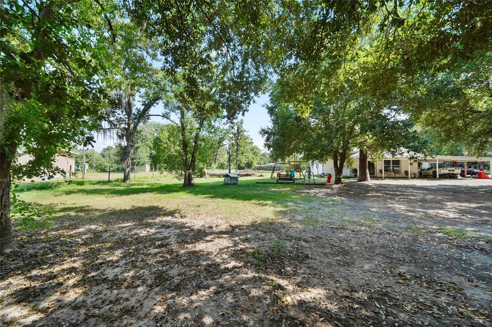 Beautiful Old Magnolia Area....1 acre unrestricted property with mature trees and tons of potential to add.