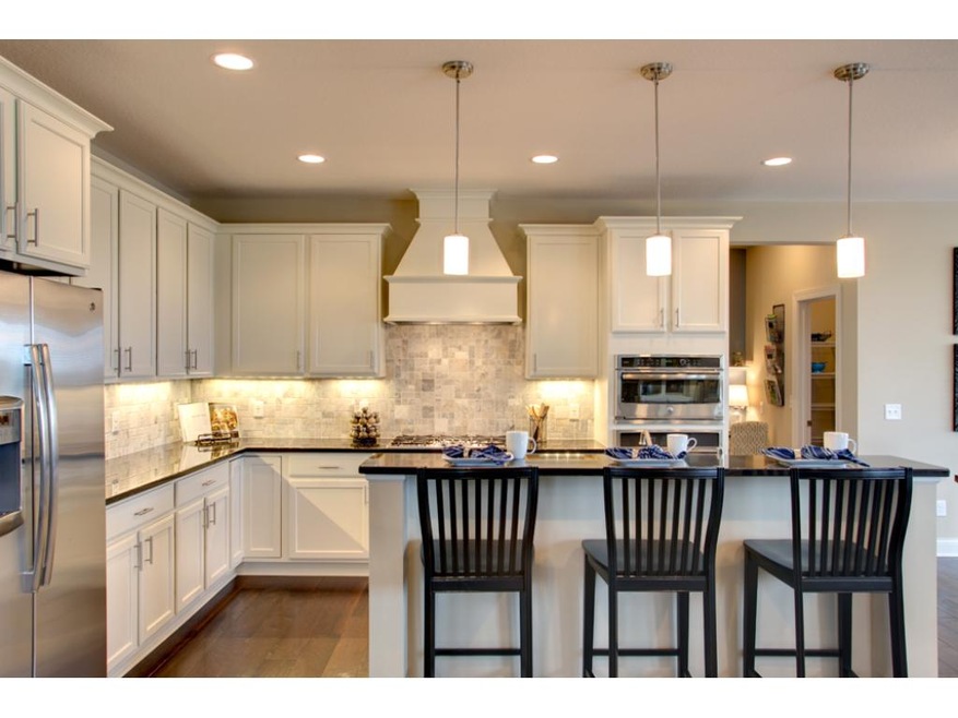 This beautiful kitchen is designed with double ove