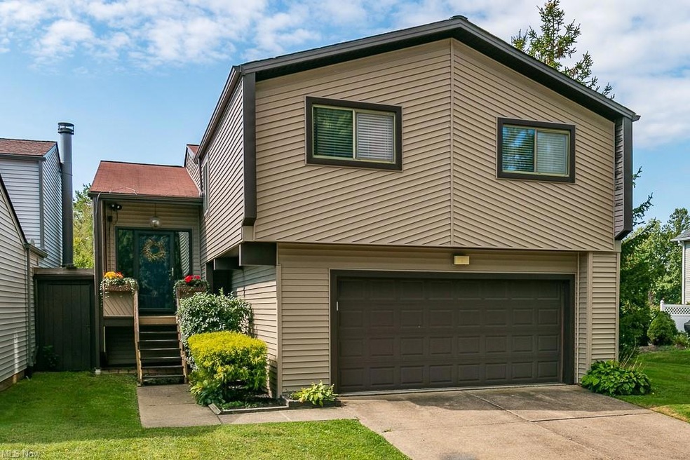View of front of property with garage and a front 